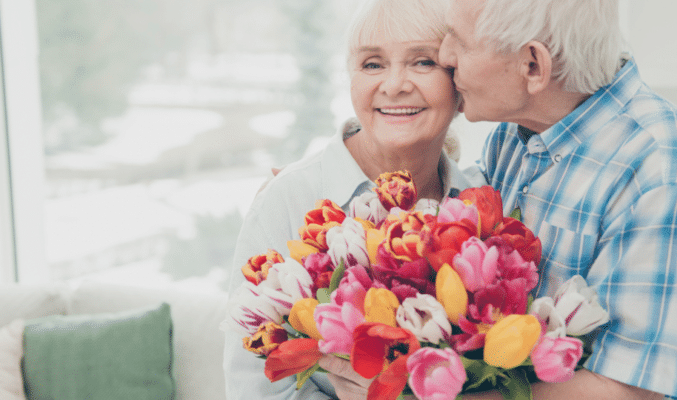 Senior couple with flowers