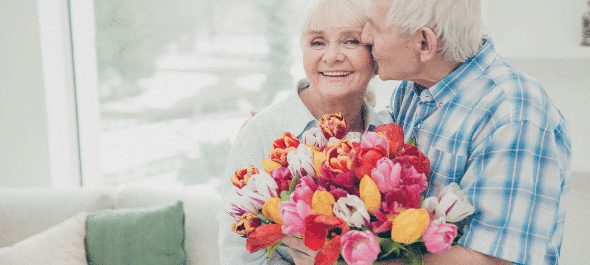 Senior couple with flowers