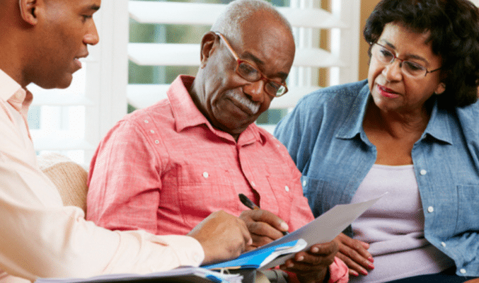 Seniors looking at documents