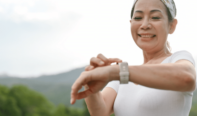 woman looking at smartwatch