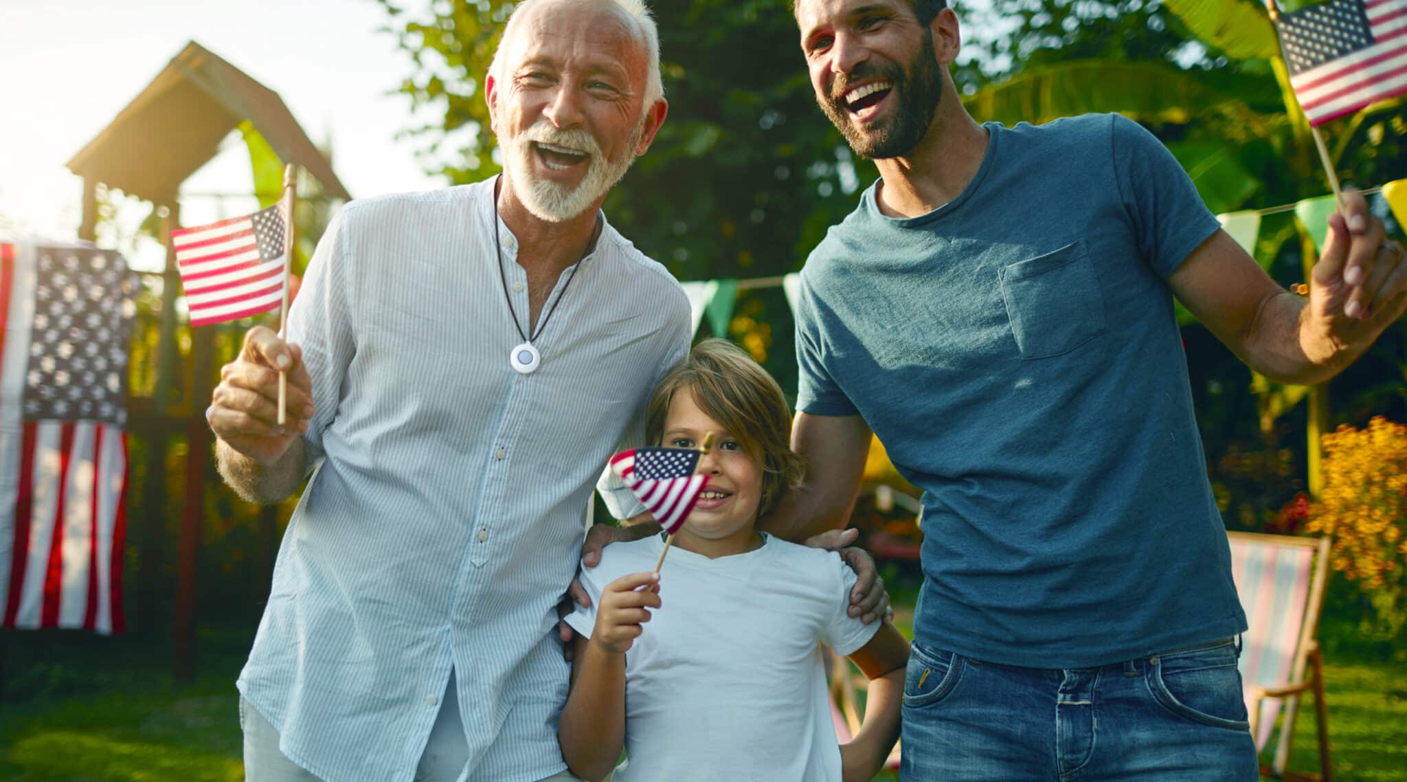 Three Generations of Men with American Flags