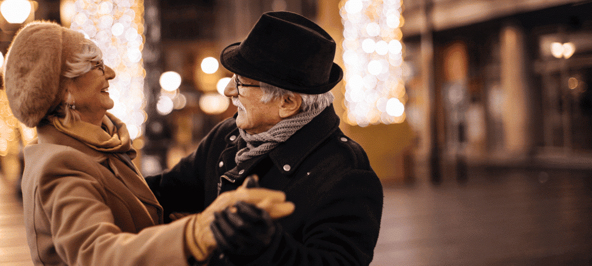 Man Women Dancing In The Street In Winter