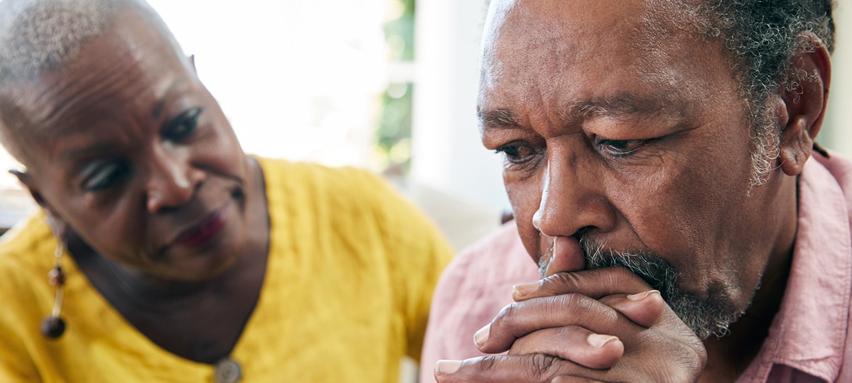 Upset Man Receiving Support from Woman