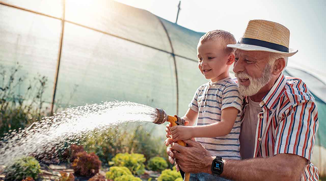 Grandfather and Grandson Watering Garden