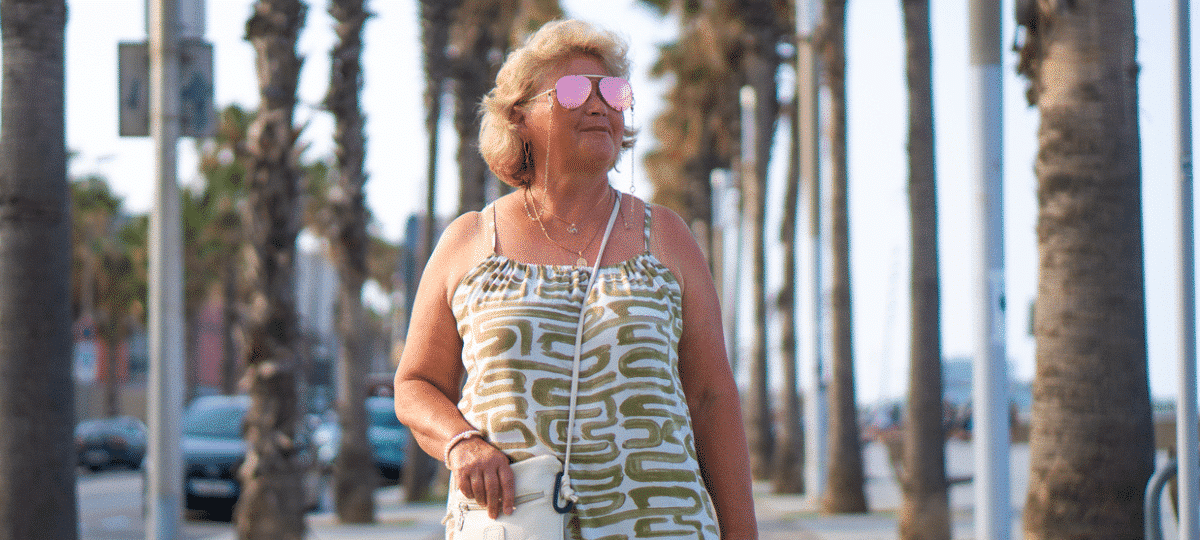 Woman Walking with Pink Sun Glasses