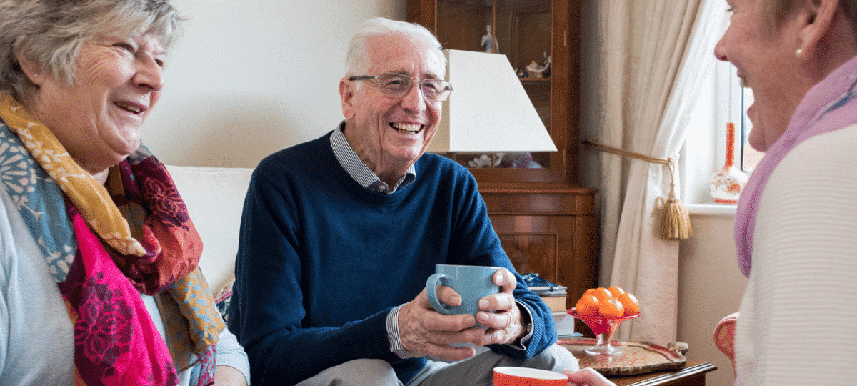 Friendly Seniors Talking Over Coffee