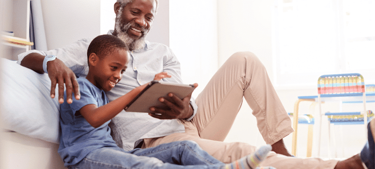 Grandfather and Grandson Using Tablet